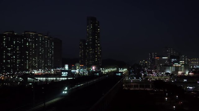 High-speed trains slowly passing through the station, night scenery