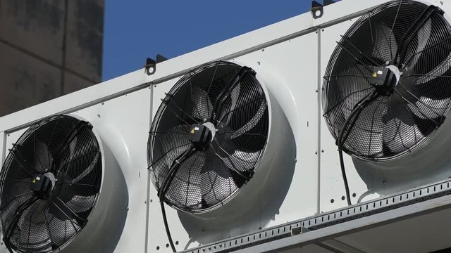 Industrial air condition fan compressor in operation on large supermarket store