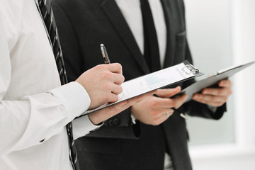 close up. business colleagues discussing documents with financial data