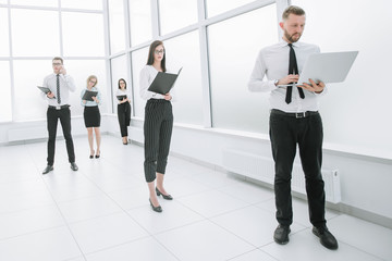 Fototapeta premium Executive employees of the company standing in the office lobby