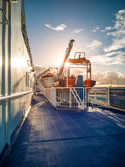Sunset on deck of a huge cruise ship vessel