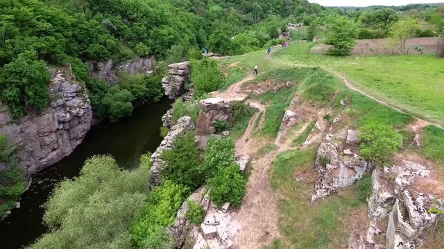 Ukrainian canyon in the village of Buki bird's-eye view. Drone removes from the height of the canyon of the Buka River, white cliffs, meadows, trees.