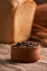 Fototapeta na wymiar Peppercorns in a wooden bowl on table with food rustic style. Homemade food