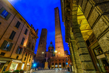 The most famous of the towers of Bologna are the central "Due Torri" (Asinelli and Garisenda) in Bologna at night, Emilia Romagna, Italy © Ekaterina Belova