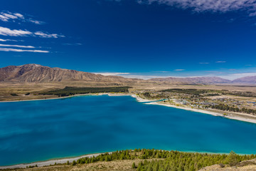 Lake Tekapo with reflection of sky and mountains, New Zealand