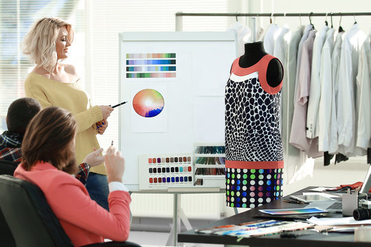 group of designers discussing a new clothing collection