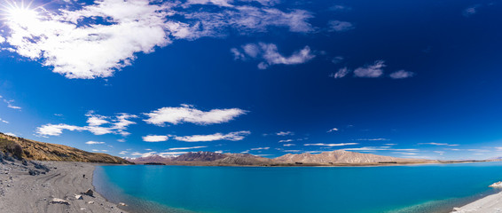 Lake Tekapo with reflection of sky and mountains, New Zealand