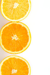 slices of fresh orange on white background