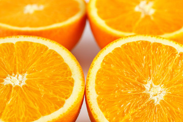 slices of fresh orange on white background