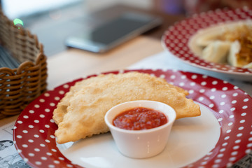 Russian food on red plate
