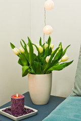 Bedroom decoration, corner with tulips and candle