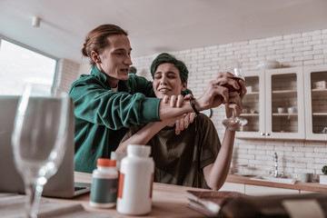 Husband taking care of wife having problems with alcohol