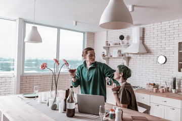 Husband berating his wife for drinking too much alcohol