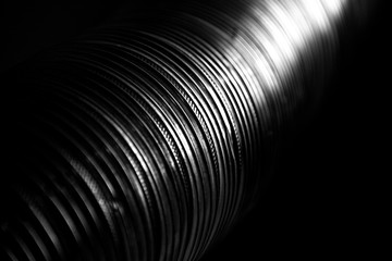 Aluminum pipe against dark black background