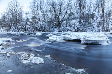 Beautiful frozen waterfall in winter. Jagala, Estonia, Eastern Europe.