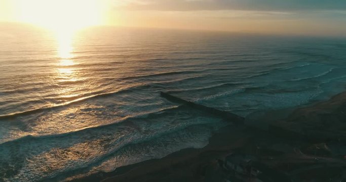 Aerial shot of the beach in Tijuana at sunset.