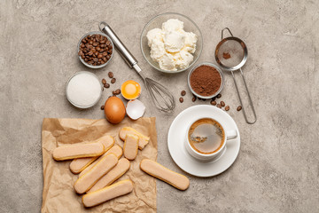 Ingredients for cooking tiramisu - Savoiardi biscuit cookies, mascarpone, cream, sugar, cocoa, coffee and egg