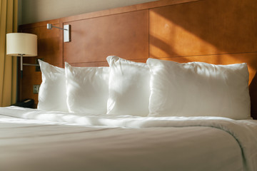 White clean pillows on bed