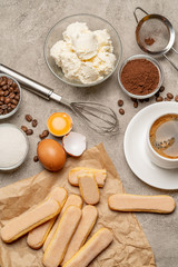 Ingredients for cooking tiramisu - Savoiardi biscuit cookies, mascarpone, cream, sugar, cocoa, coffee and egg