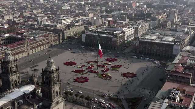 Aerial shot of Mexico City  cathedral and the main square with the mexican flag and christmas decoration.