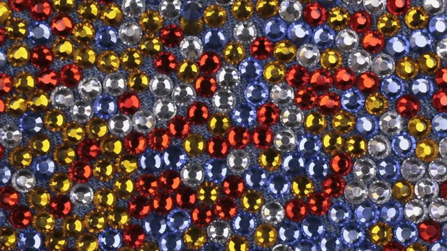 Rotation of multi-colored rhinestones with beautiful light reflections.