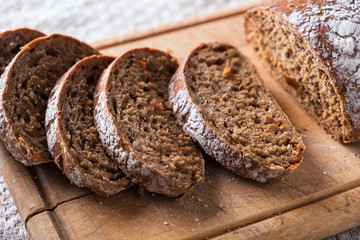 Sliced  bread on wooden board. Closeup