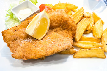 Chicken Milanese schnitzel with roasted potatoes