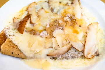 top view crepes with Gorgonzola and pear close up