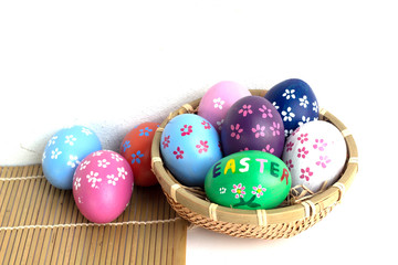 Fototapeta na wymiar easter eggs in basket on white background