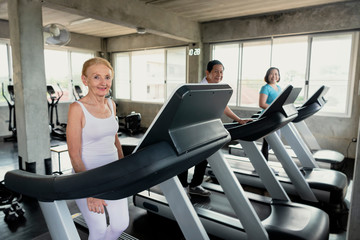 Group friend of senior runner at gym fitness smiling and happy. elderly healthy lifestyle.