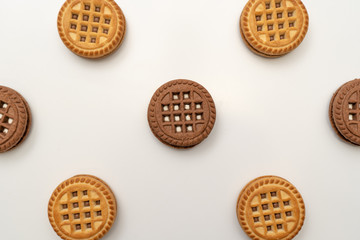 Vanilla and chocolate cookies on a white background