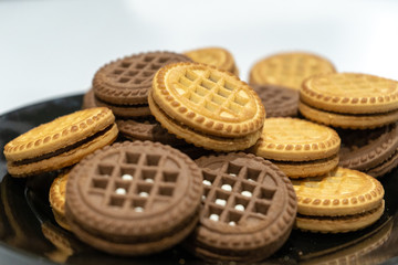 Close-up of cookies on big white plate