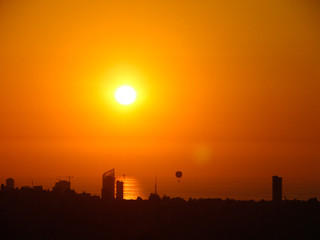 This is a capture of the sunset in Beirut capital of Lebanon with warm orange color, taken in summer 2006 and you can see Beirut downtown in the foreground.