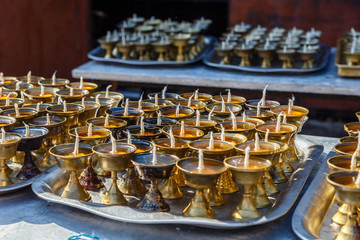 Praying memory candles in a temple, Nepal