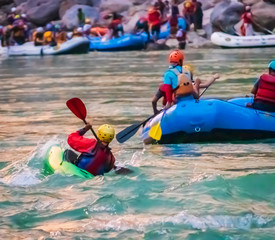 Naklejka premium Young person rafting on the river Ganges in Rishikesh, extreme and fun sport at tourist attraction