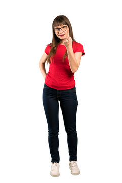 Full-length shot of Woman with glasses inviting to come with hand. Happy that you came