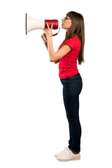 Full-length shot of Woman with glasses shouting through a megaphone