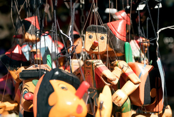 Wooden toys Pinocchio for sale in souvenir store of italian city