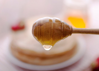 Hot and fragrant pancakes with honey.