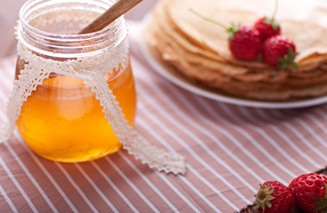 Hot and fragrant pancakes with honey.