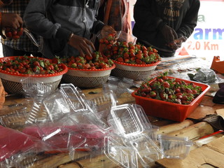 colorful strawberry fruits in a basket closeup