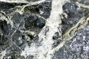 Mineral asbestos macro photography. Harmful, dangerous minral. Asbestos fibers in rock close-up.