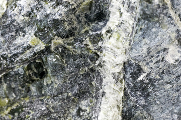 Mineral asbestos macro photography. Harmful, dangerous minral. Asbestos fibers in rock close-up.