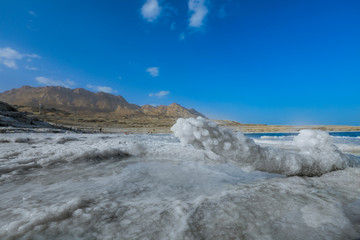 Fototapeta na wymiar Salty Pieces on the Coastline of the Dead Sea, Israel