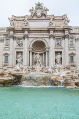 Fototapeta na wymiar Trevi Fountain in the morning light in Rome, Italy. Trevi is most famous fountain of Rome. Architecture and landmark of Rome.