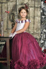 Vintage portrait of little girl in purple dress