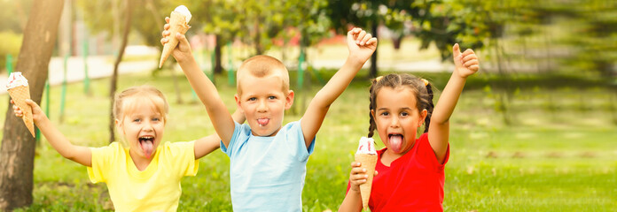 Group of happy little friends having fun at the yard.