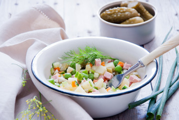 Russian olivier salad with meat and vegetables