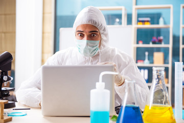 Male biotechnology scientist chemist working in the lab