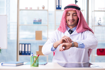 Arab doctor working in the clinic 